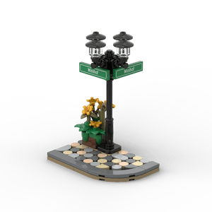 Schwarzer Ecklaternenpfahl mit Blumenkasten - Grüne Schilder